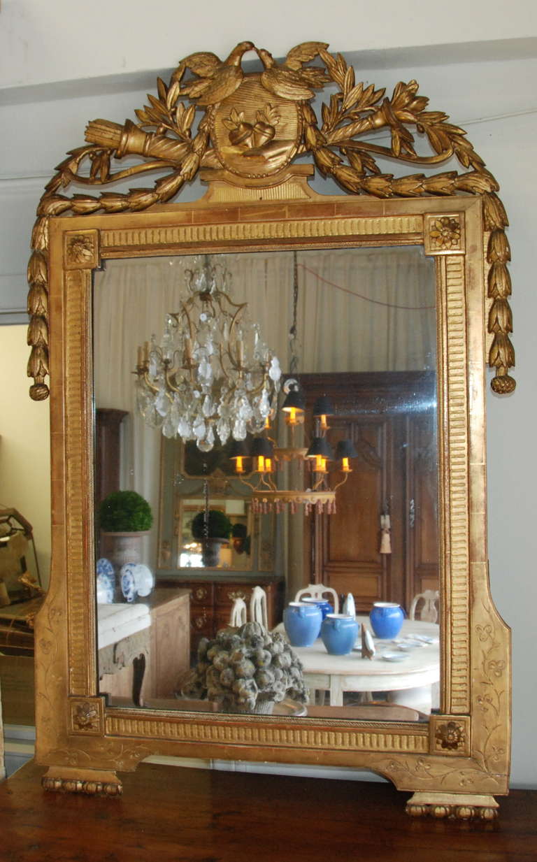 Beautiful 18th century gilt Mirror de Mariage from Provence, France. Carved Doves and acanthus along the sides. Original mercury glass.