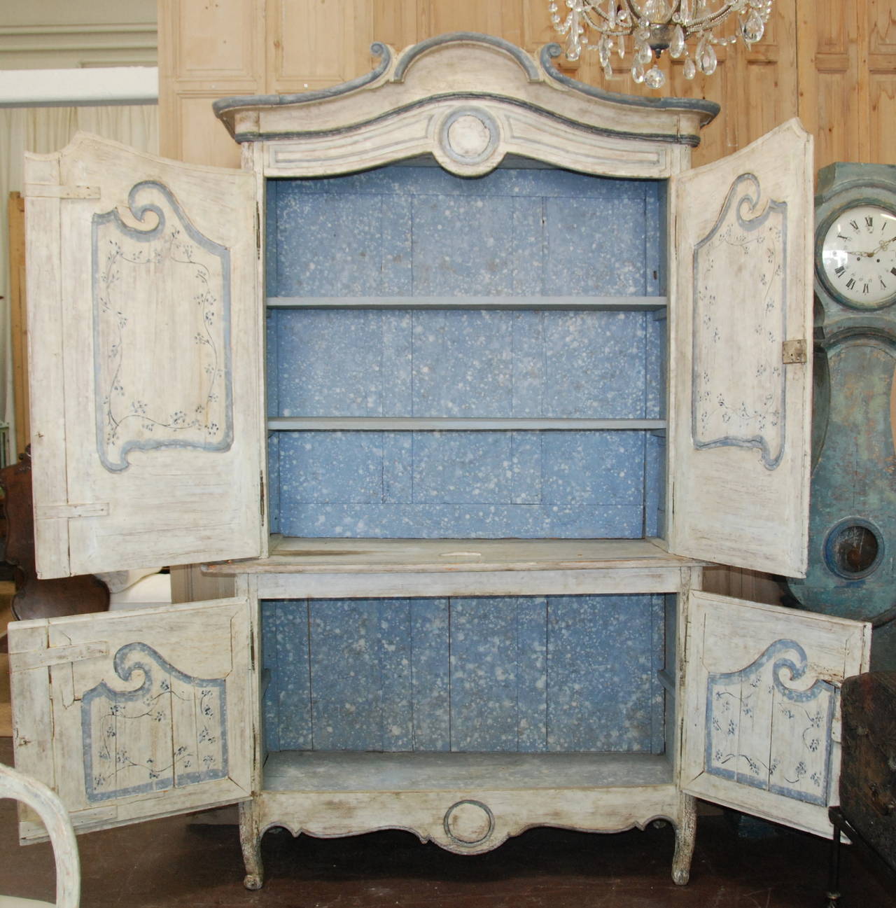 Lovely painted French buffet a Deux Corps from Provence, circa 1800. Original cream and blue painted exterior. Interior paint is old, but not original with two newly restored shelves.