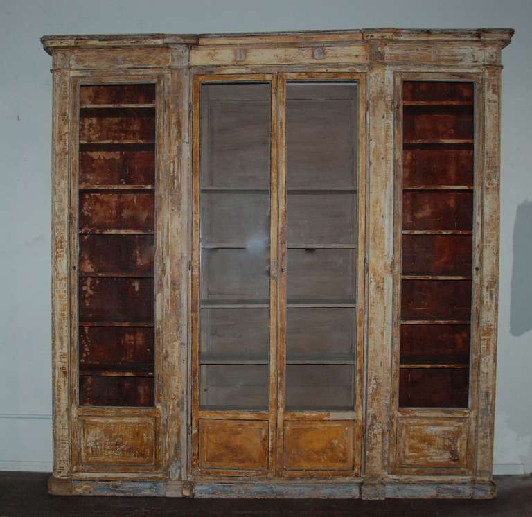 Wonderful 19th century pharmacy cupboard scraped down to the original ochre grey and blue color. Parma, Italy