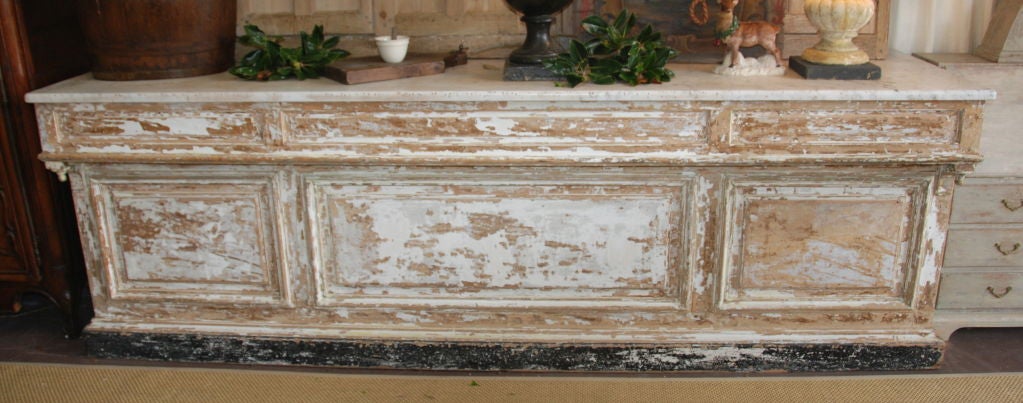 Fantastic Patisserie Counter from Paris, France. Original marble top. Original scrubbed white paint. c1850. Pine base Storage and drawers located on the back. Beautiful side panels with fineals.  Great for an island counter in kitchens or retail