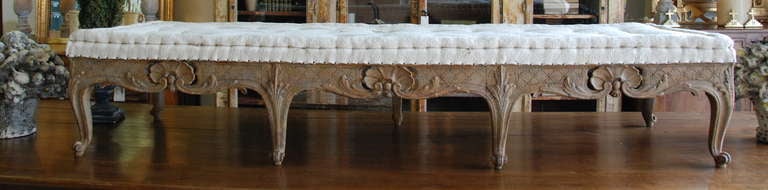 Beautiful period Rococo footstool scraped down to the original wood color. Lovely shell carvings with elegant turned legs and feet. Natural patina of hints of soft white. Stolkholm, Sweden.