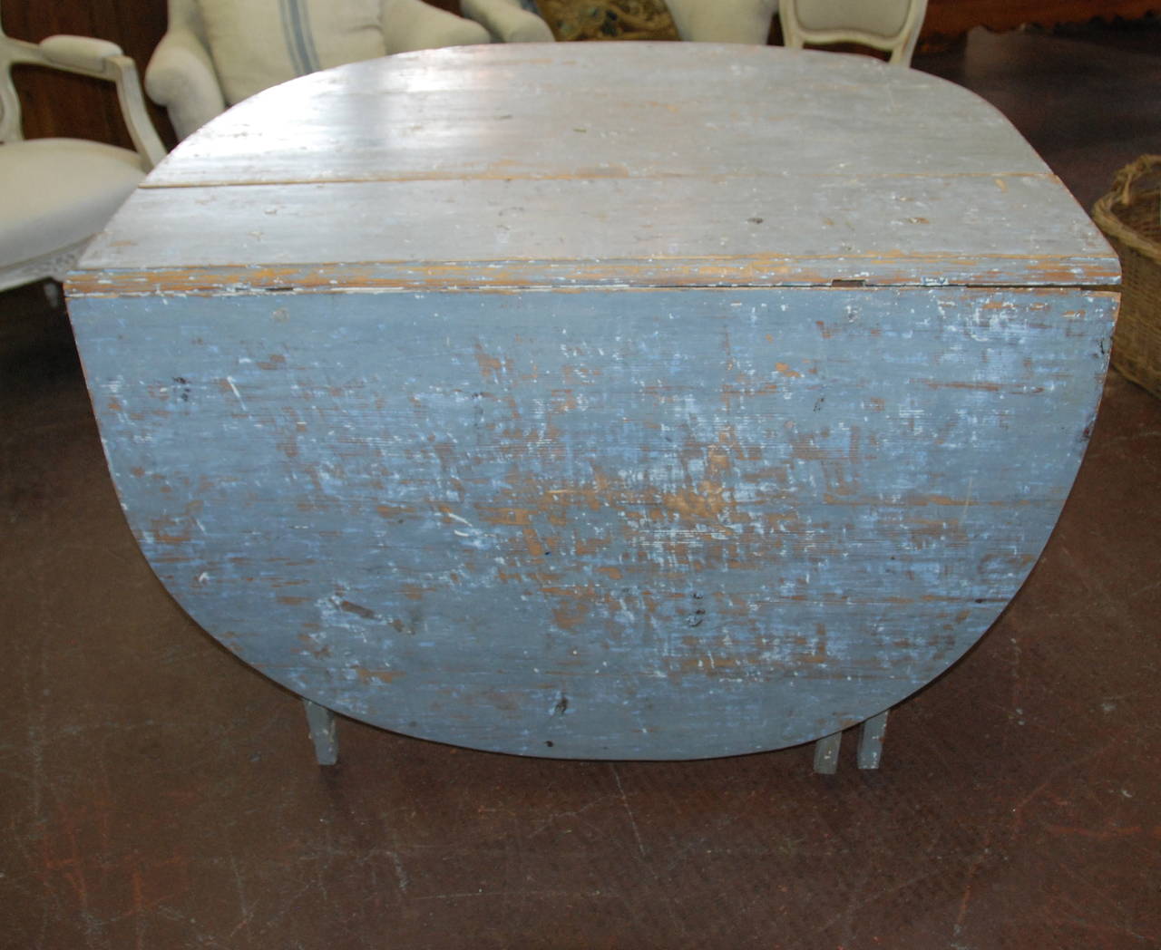 Very nice early 19th century Swedish drop-leaf table with aged blue patina. Tapered legs and iron hinges all original.