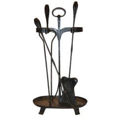 Four piece fireplace tool set by Gustav Stickley