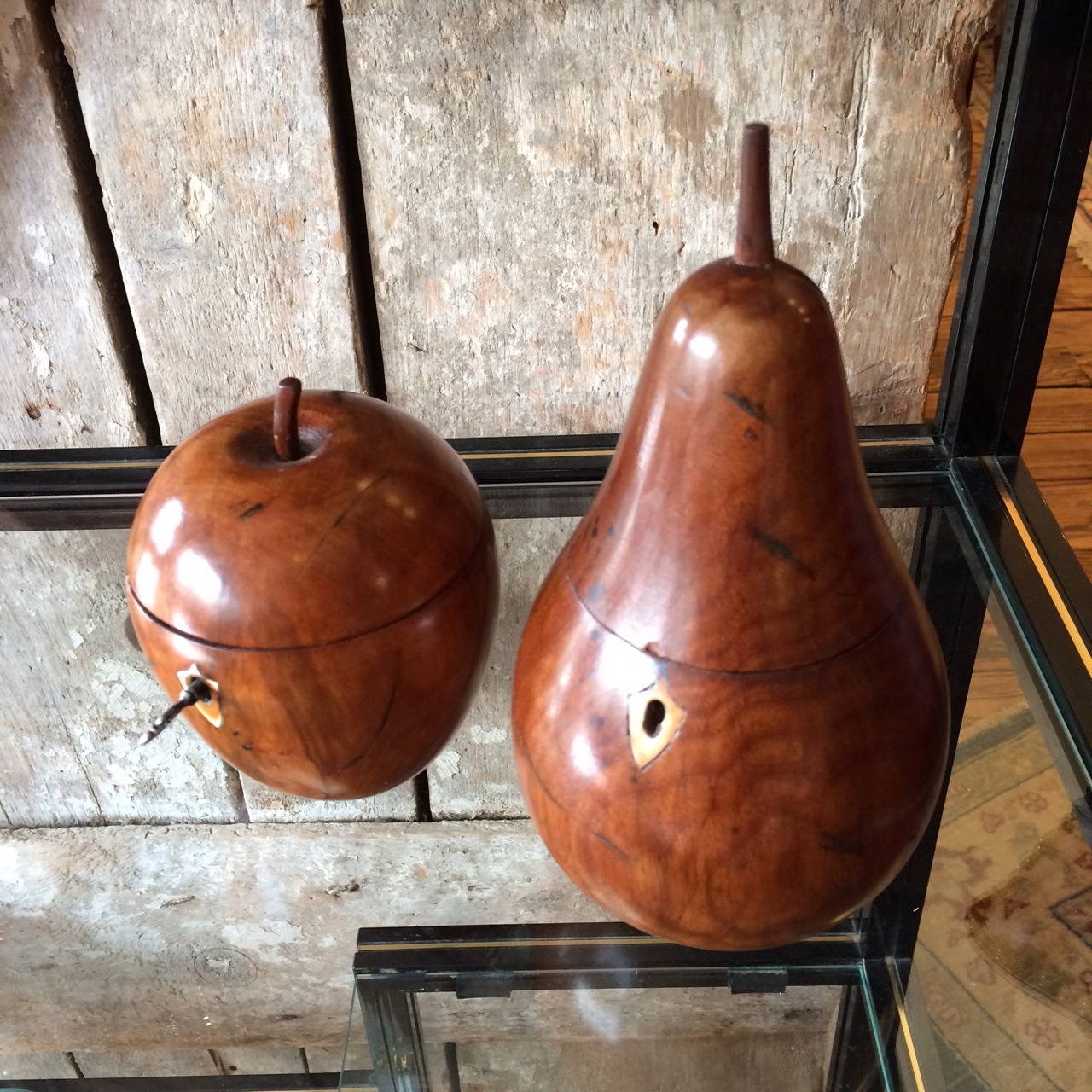Beautifully crafted wooden apple and pear that open and were once used as tea caddies.  Bottom has initials 