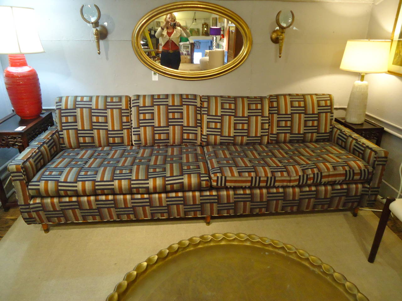 Custom-made sophisticated sofa, Mid-Century Modern Silhouette, handsome geometric upholstery in black, grey, cream and rust. Two seat cushions, four back cushions. No labels.