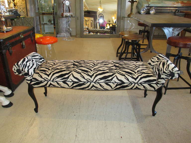 1920's Hollywood Regency Style Bench
Newly upholstered in a striking zebra print,  w/ ebonized legs and linen black buttons on the arms