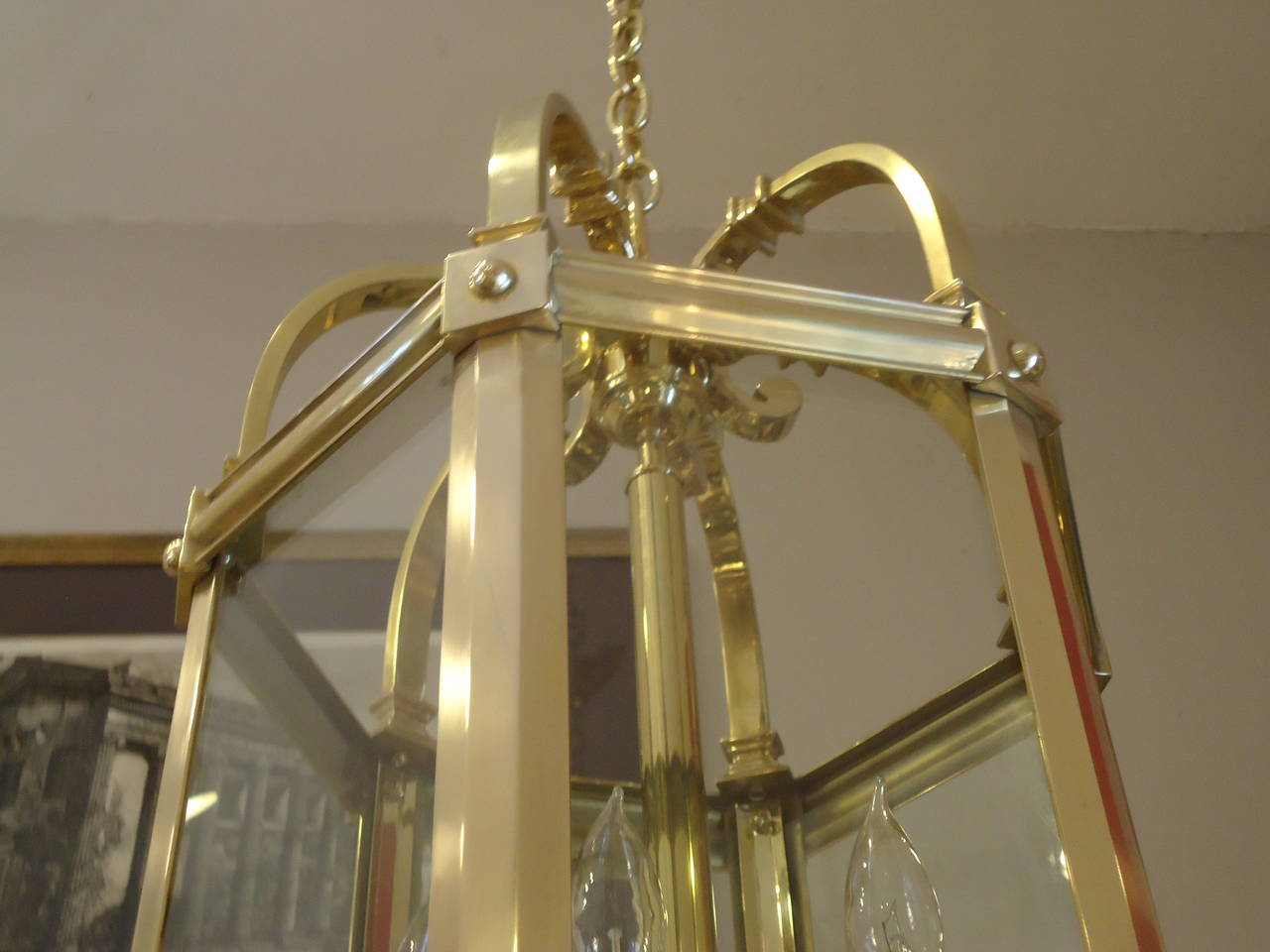 Very heavy and massive lantern, regal in scale and craftsmanship. 
Brass with glass, four arms, 40-60 watt each.