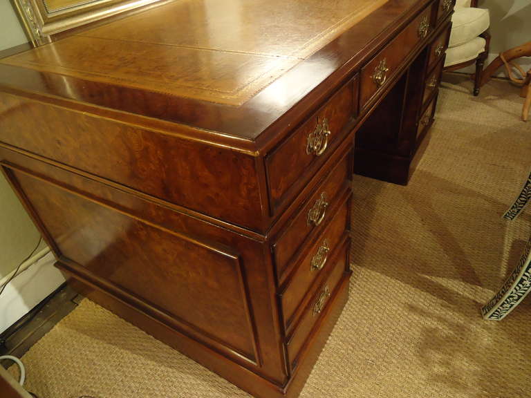 Georgian style burled walnut pedestal desk in 3 parts.  Easy to move.  Top is tooled leather with gold periphery.