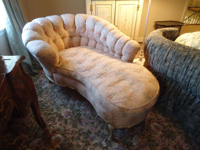 Sumptuous perch for pampering, sexy tufted curved back, long unusual kidney-shaped seat, and cream and gold Frenchy legs. Pretty light pink floral silk fabric. 
Label says Jamestown Royal, Jamestown NY.  
Seat 20 D 50 L.