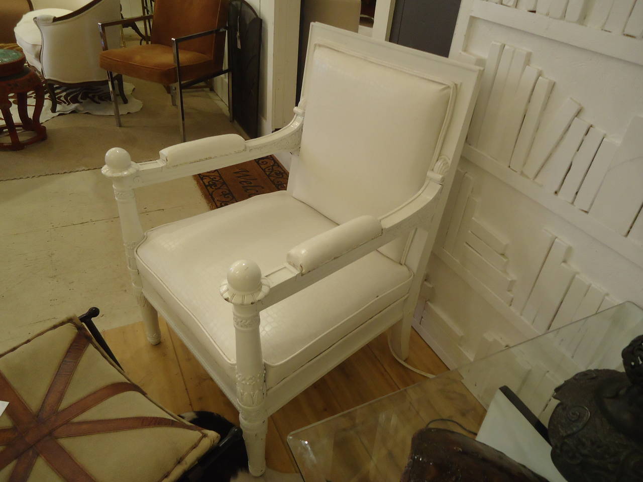 Heavy, chunky and glamorous throne chairs, pretty carved wood painted white and chippy from age. Upholstery is faux white reptile; needs some minor repair esp. With loose or missing welting. One stain on one seat, a very light blue area that might