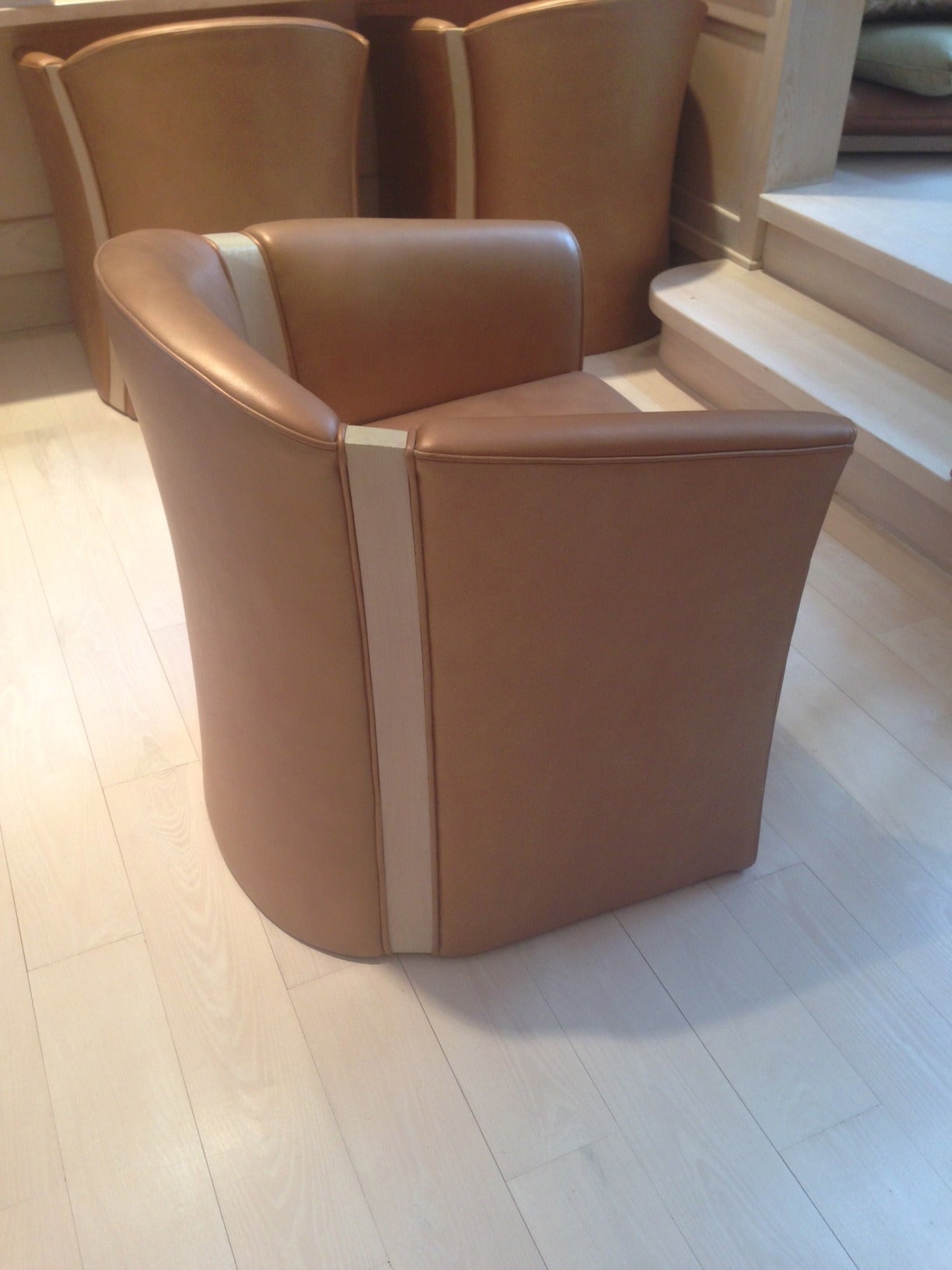 Set of 4 Steve Grafton Barrel back chairs.  Supple Light Brown Leather with wood inset. Custom made.

Seat depth 20