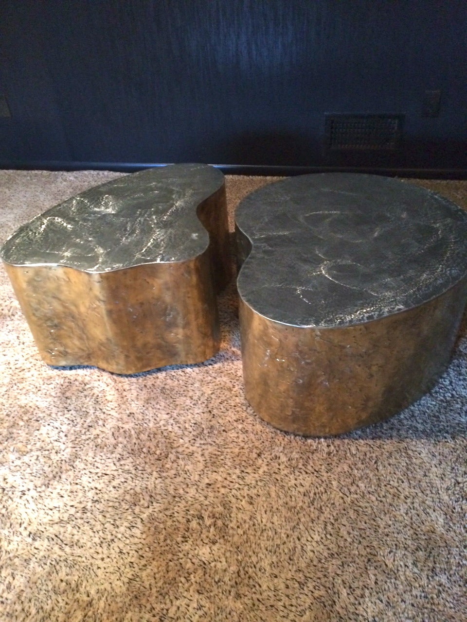 A pair of Silas Seandel vintage free-form tables on casters.   Very versatile as can be utilized together as a coffee or cocktail table, or split up as side tables. They are patinated, hammered brass/bronze finish.
Signed
Dimensions
