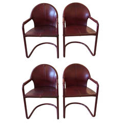 Four Rich Italian Cranberry Leather and Aluminum Armchairs