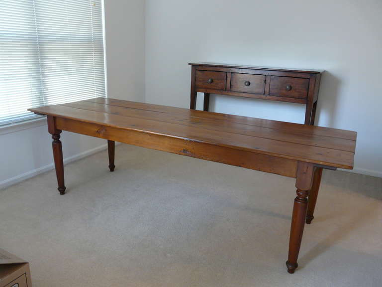 Natural cherrywood. Well maintained. Top and apron are original 19th century. Legs are newer, but don't know age. They are also cherrywood and nicely turned.
Floor to bottom of apron: 24