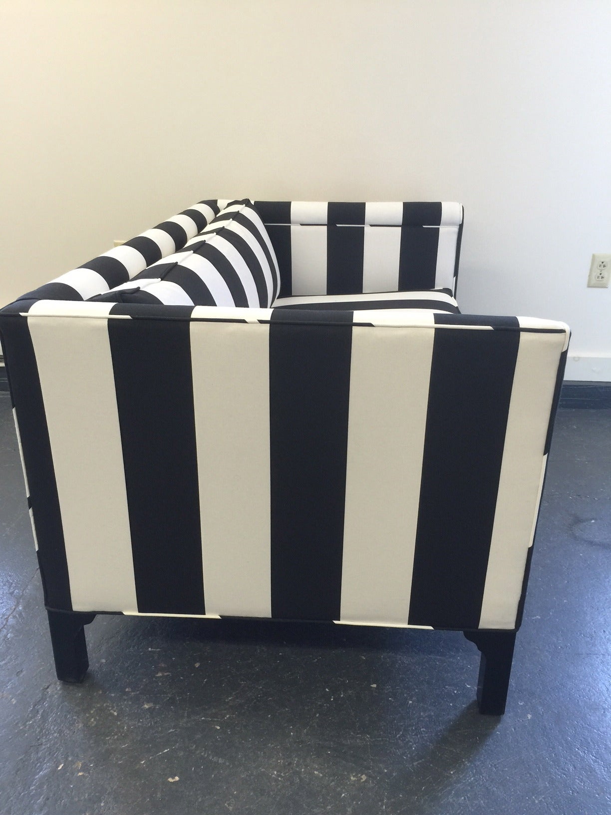 Glamorous black and white loveseat, just newly recovered with Serena and Lily  striped fabric. Feet are ebonized high gloss wood. Single foam seat cushions, very comfy and sophisticated.