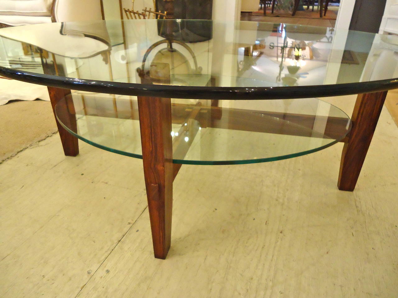 Sleek Danish inspired design, tongue and groove rosewood base, two tiers of elegant oval glass.  Top surface is top of the line 3/4