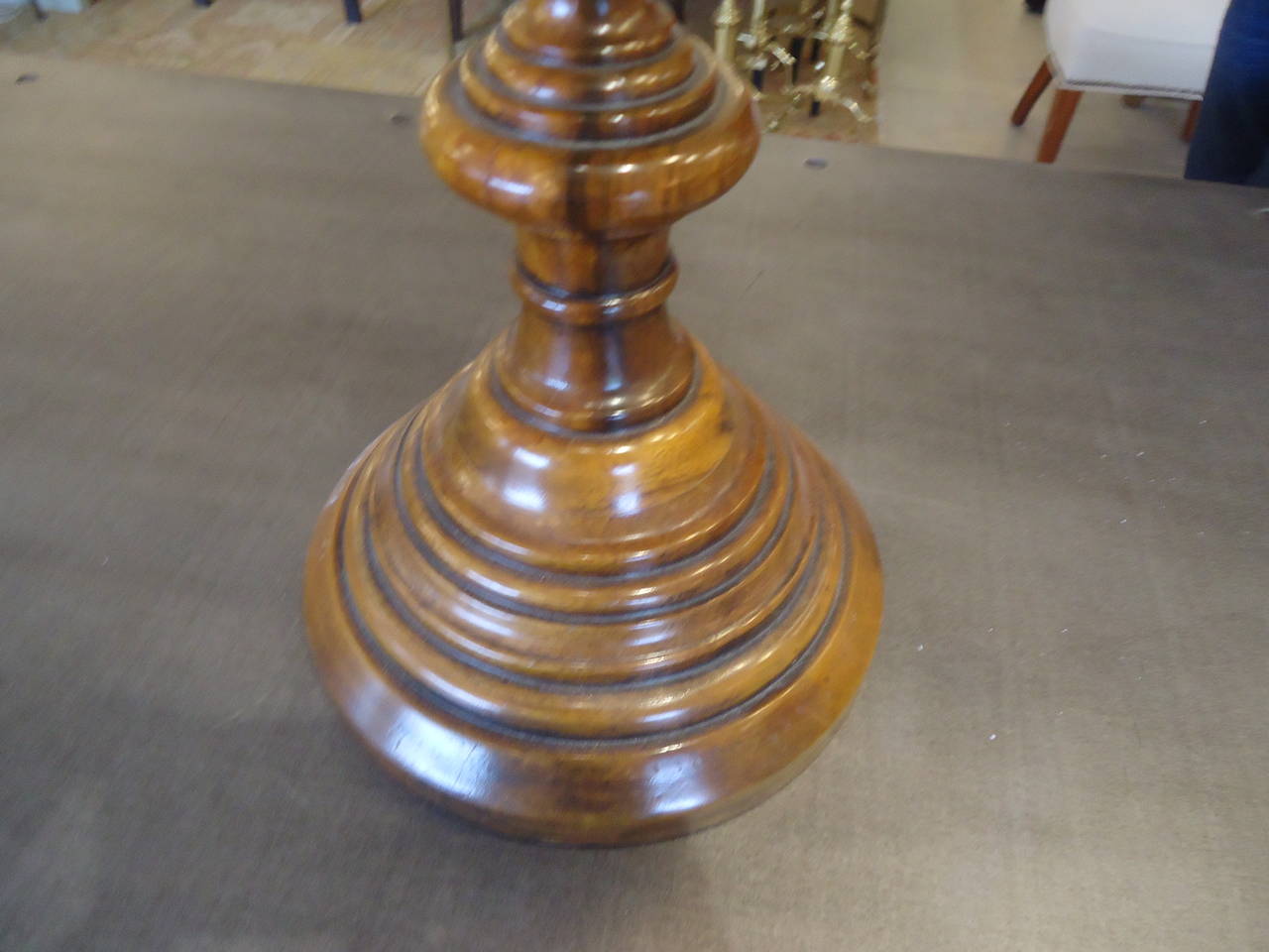 Handsome large sculptural accessory, one of a kind, wooden brown and taupe/cream inlaid wooden sphere, eye catching yet subtle.  Custom carved walnut stand which is 9