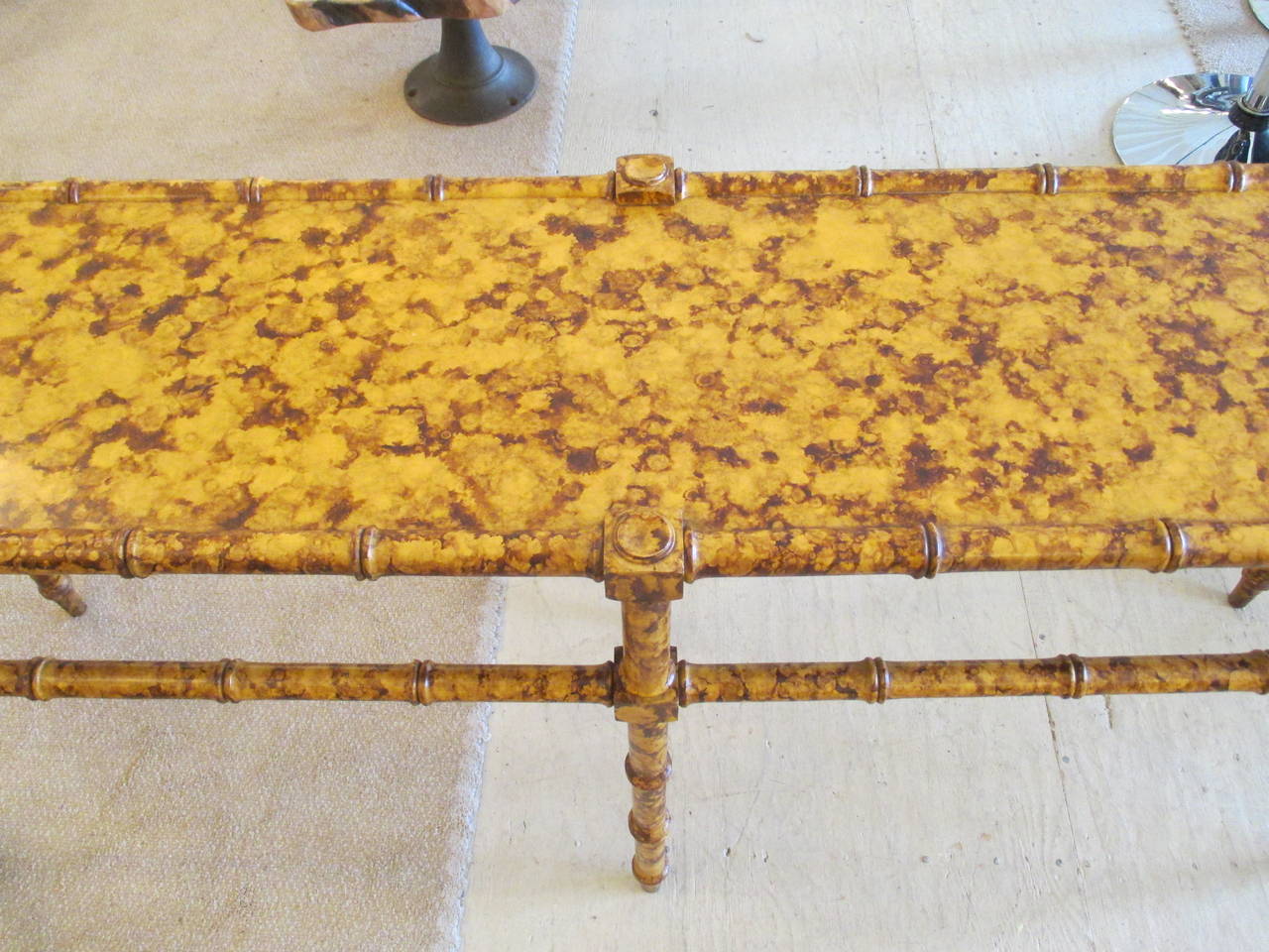 Vintage faux bamboo sofa console table in a fabulous tortoiseshell painted finish.
 1970s. Measurements : 5' W x 27