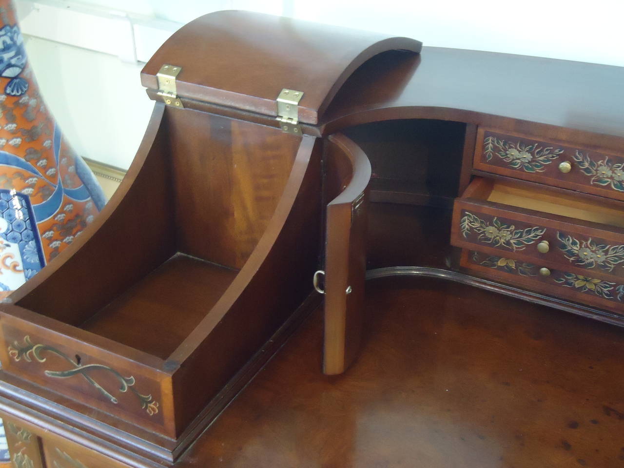 Carlton House desk, with Wellington label inside one drawer. Beautifully decorated in the Adams style, gorgeous curved design, lovely front and back. Writing surface is 17.5 D x 34.5 W.