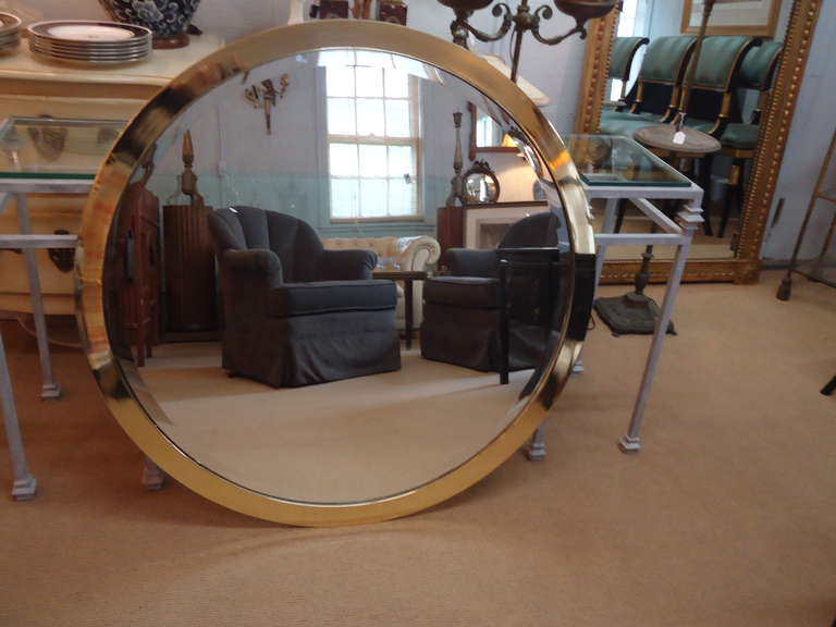 Unusual to find a vintage mirror this size.  Brass frame around a bevelled mirror.  Design Institute of America tag on back.