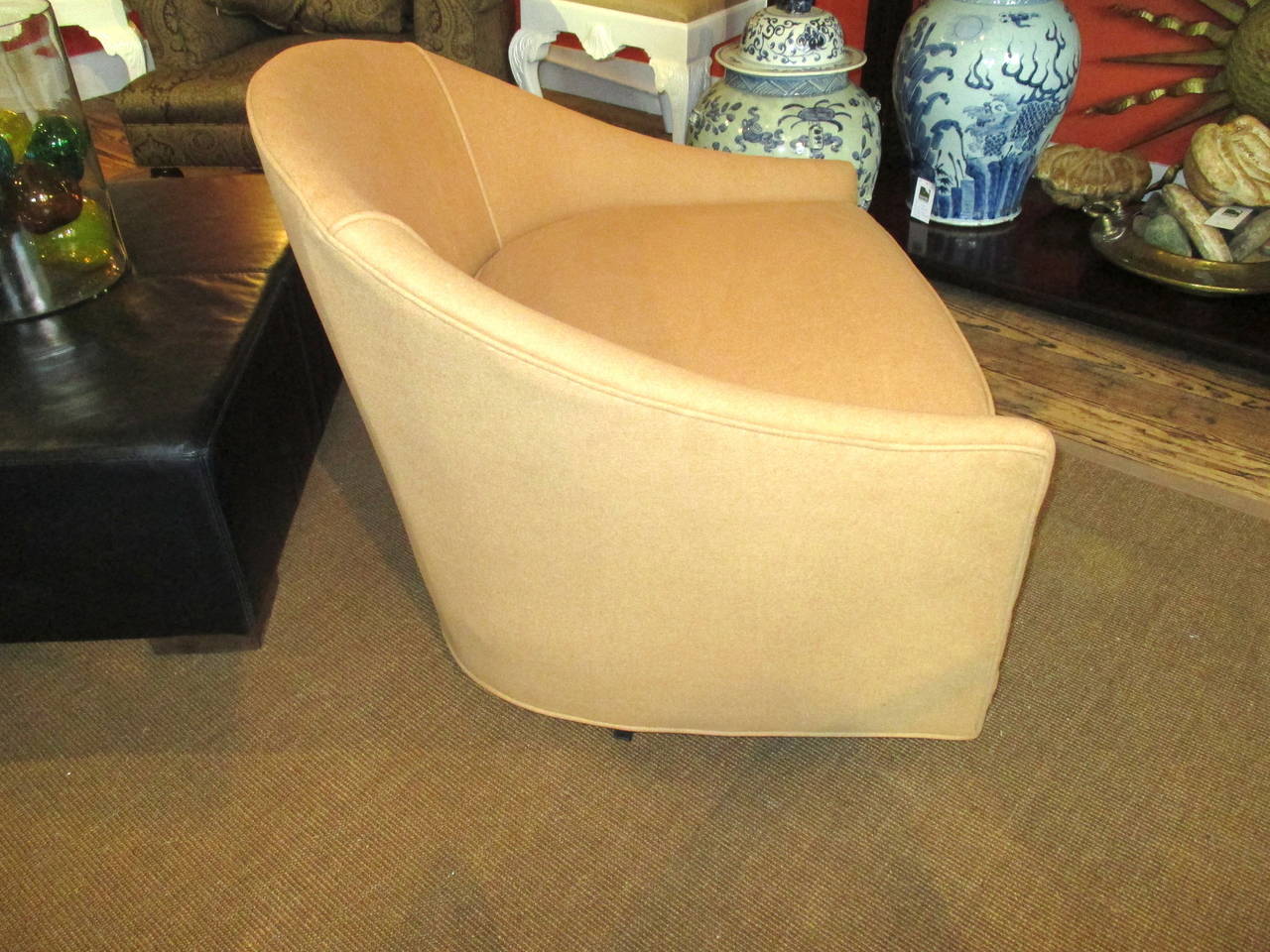 Pair of Milo Baughman style barrel back swivel chairs in Ralph Lauren camel fabric; fabric has been backed and scotch guarded.
Measures: Seat height 17.
Seat depth 22.5.
