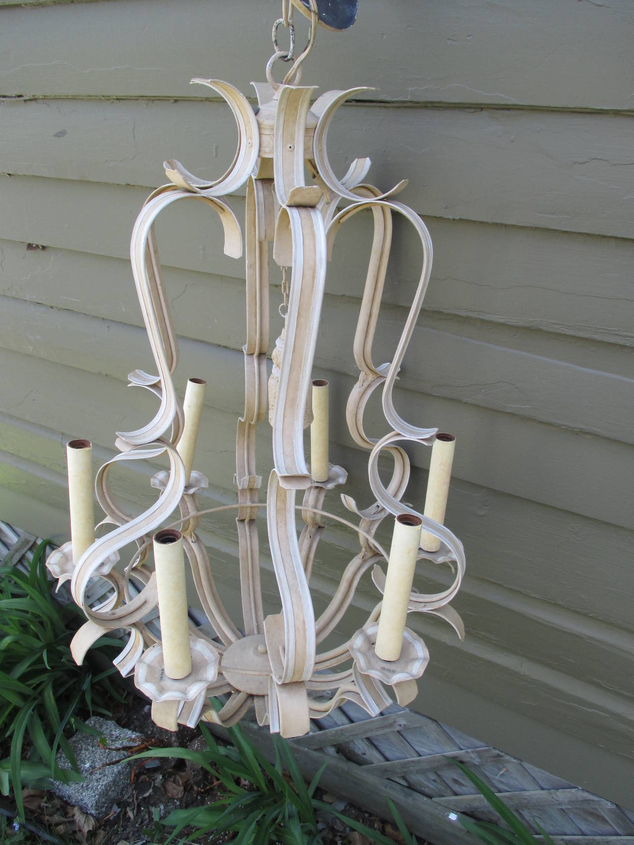 Great looking painted metal chandelier in cream and white, model is "Mantuan", but larger than the one currently made. 
Each socket 60 watt max, 8 arms.