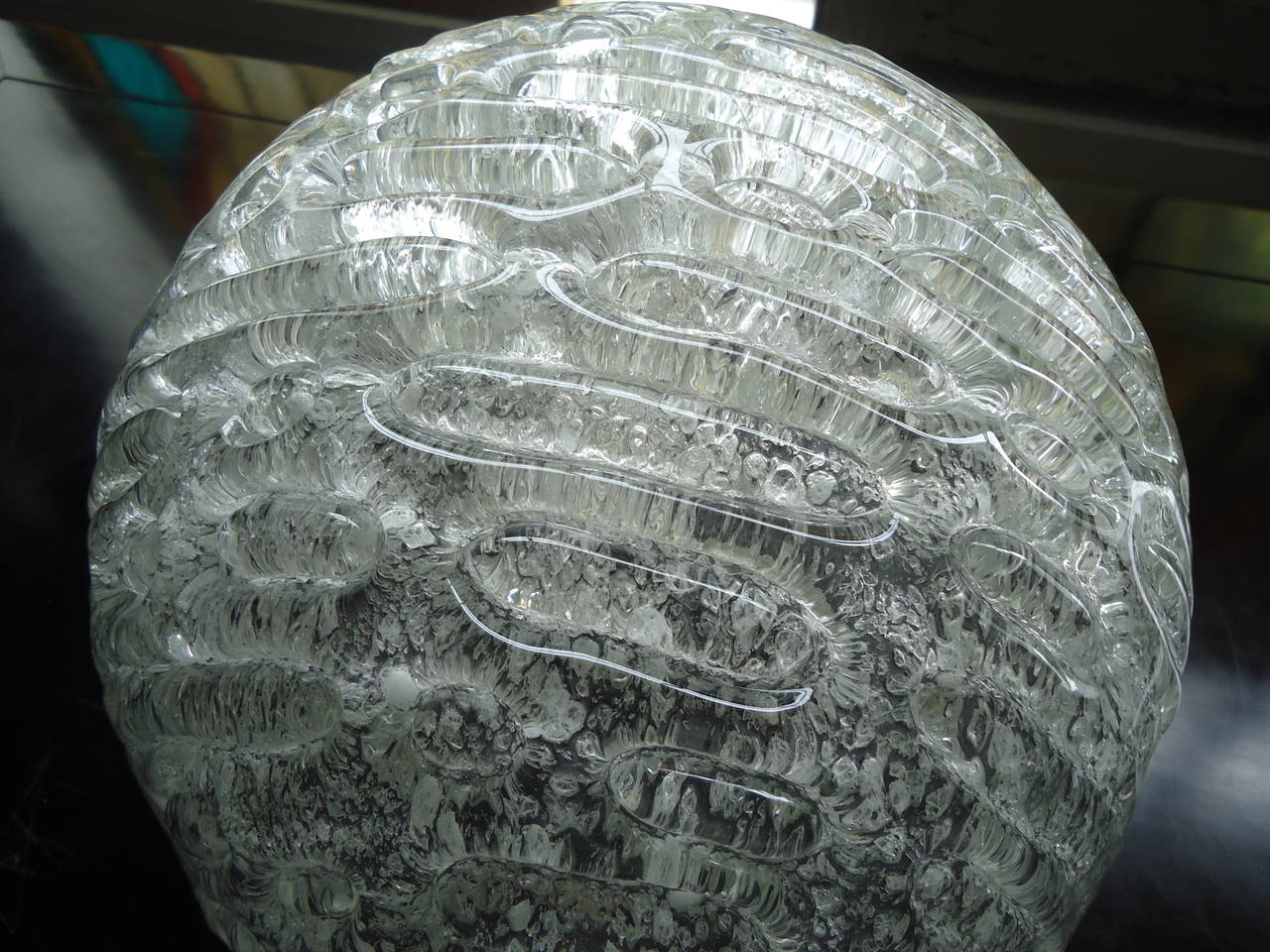Pair of thick textured art glass domes that sit flush on console or table. One socket that takes up to 60 watt in each.