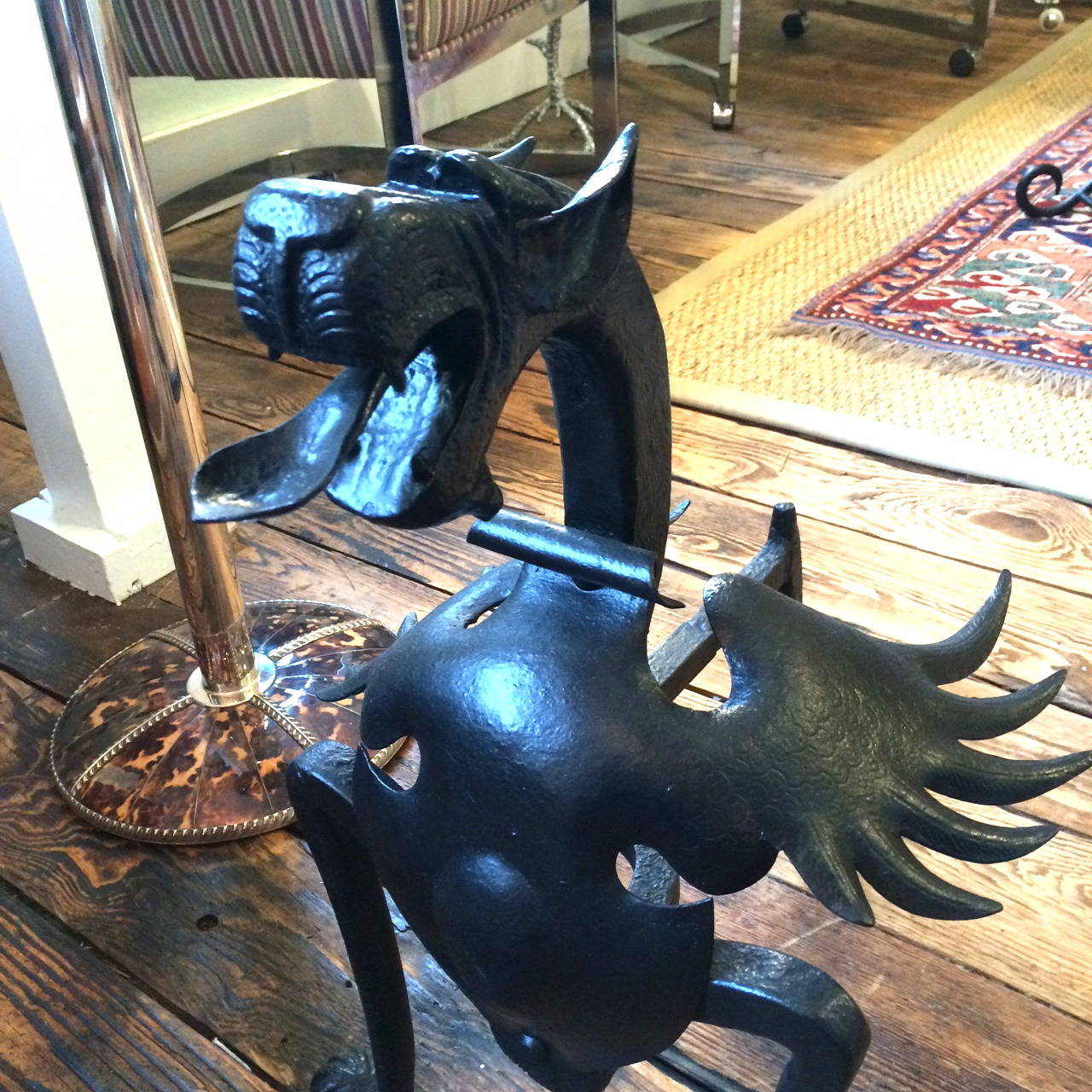 Pair of Fire-Breathing Dragon Andirons, hand-wrought iron in the Arts and Crafts style, circa 1930’s, in the manner of Samuel Yellin, New Hope, PA, (and found in Bucks County, PA), with fully articulated spread wings, the entire bodies etched and