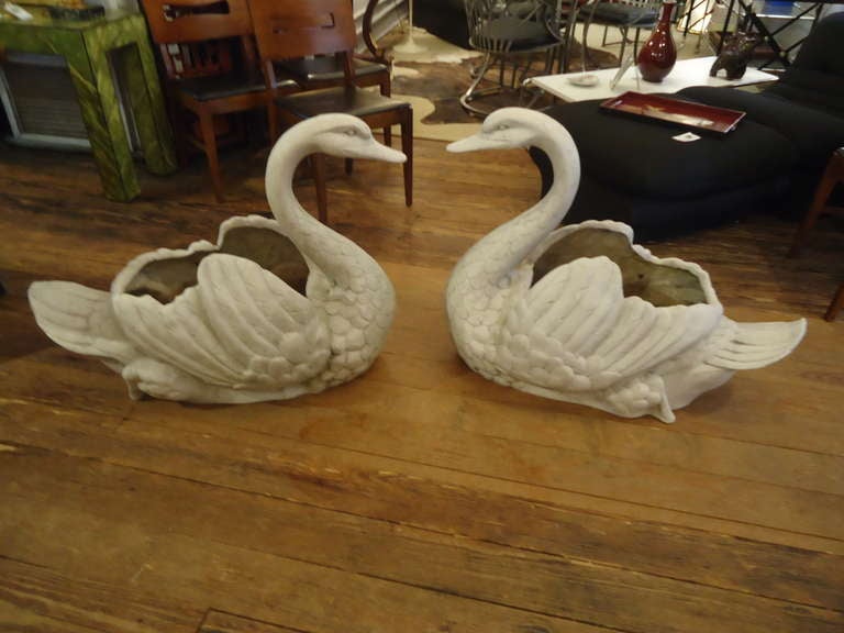 Charming fiberglass swan planters, about 35 years old; impervious to weather so great by the pool or outside the front door.  Holes in the bottom for drainage.