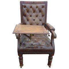 Antique Distressed Irish Mechanical Leather and Carved Wood Reading Chair