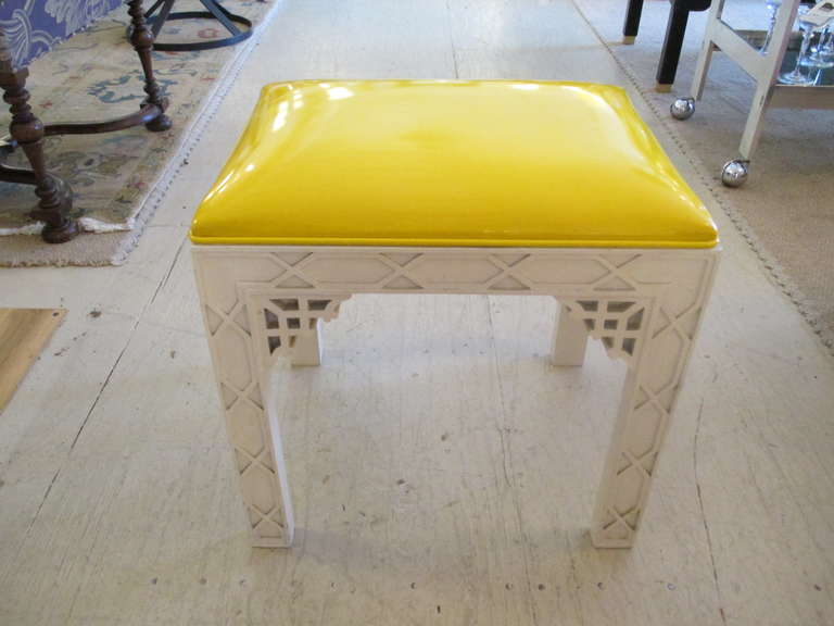 Two Chinese Chippendale white lacquered benches w/ bright yellow patent leather seats; in the style of Tony Duquette
