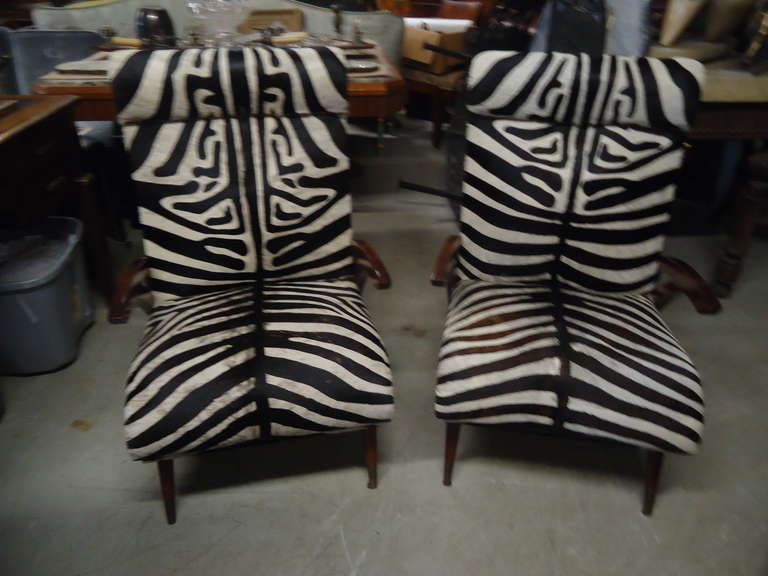 Faux zebra printed hide, beautiful upholstery job with nailhead detailing, wonderful Italian sleek silouette, polished mahogany legs.