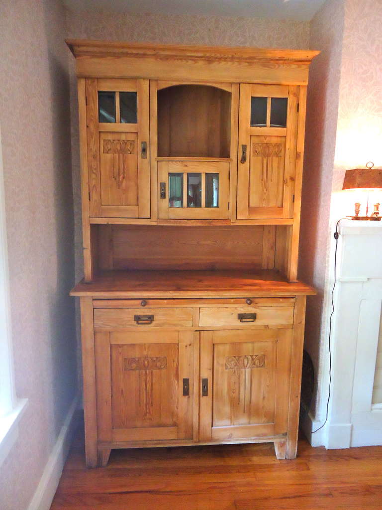 Authentic old pine cupboard, great for a dining room sideboard cabinet.
Lots of storage, bevelled glass, and decorative carving.  Also a pull out desk top for extra surface space.  2 pieces for easy moving.