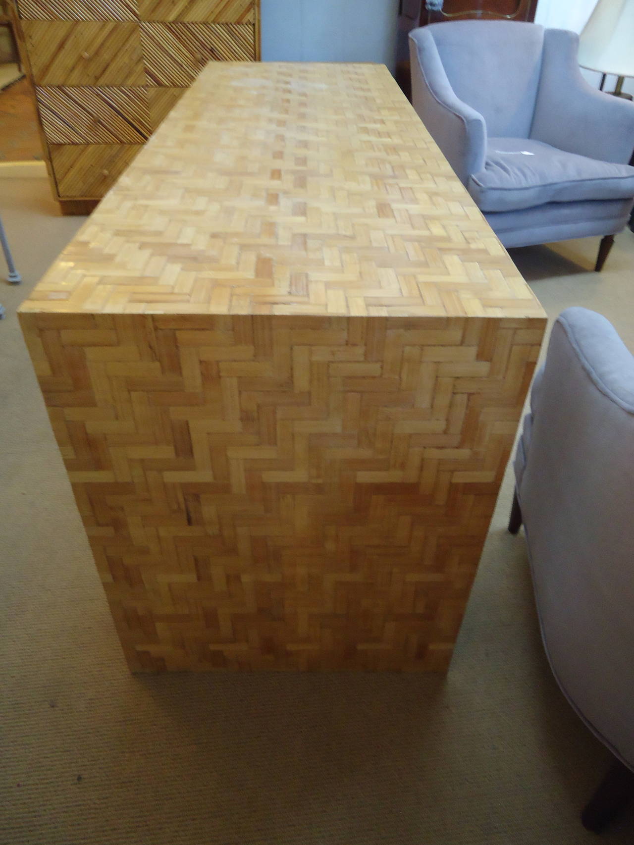 Parsons style chunky Mid-Century Modern console in bamboo reed.