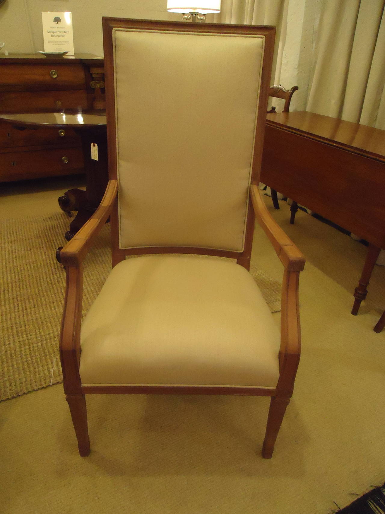 Elegant high back armchairs with raw carved mahogany frames and newly upholstered in sisal colored heavy gauge linen.
Measure: Arm to arm 23 W.
Back of chair 19.5 W.
Seat depth 21.