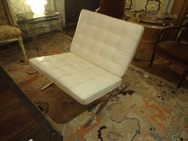 Heavy weight chrome in great shape, gently used white leather in good vintage condition with one button missing leather.  Looks exactly like the Knoll Barcelona chairs, but no markings, therefore the very reasonable price.
seat depth 24
