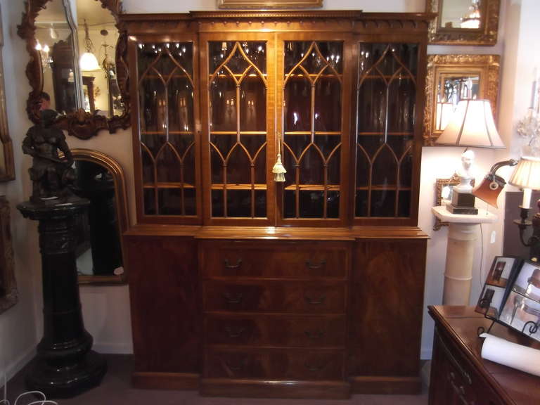 Gorgeous focal point cabinet for dining room.
The doors are individual panes of glass, high quality detail and dental molding.
The bottom has 4 drawers flanked by 2 doors and an upper leather topped pull out tray.  Lovely inlay and banding on