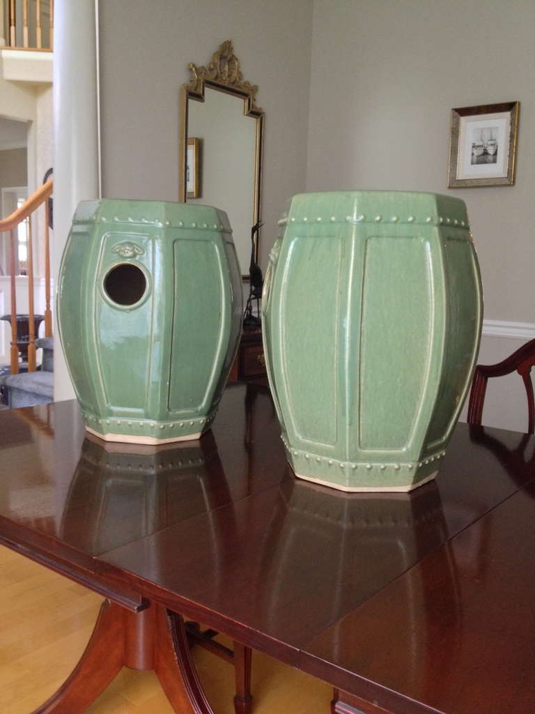 Early 20th century pair of Chinese celadon ceramic garden stool seats, foo dog decorations and holes in sides for easy moving.  Hexagonal shape.
Stamped on bases.
18.75