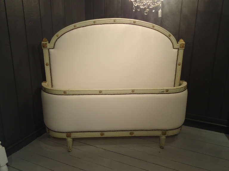 Original patina celadon green paint and gold leaf on wooden frame, newly upholstered in white duck.  Designed for a double mattress.
The Headboard is 55