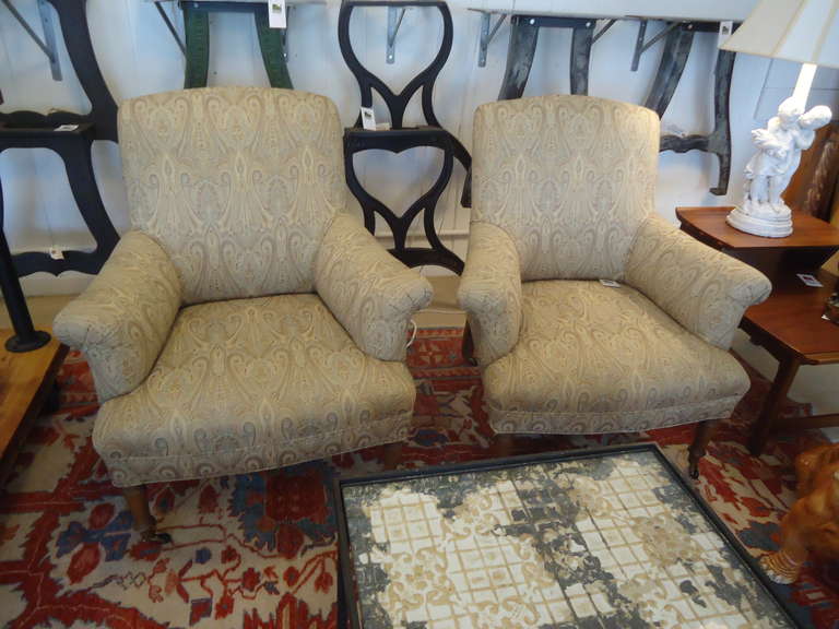 Great compact size, comfortable vintage club chairs redone in a neutral Brunschwig and Fils paisley.  Colors are camel, raw umber, and grey.  Wooden 
short legs on casters.