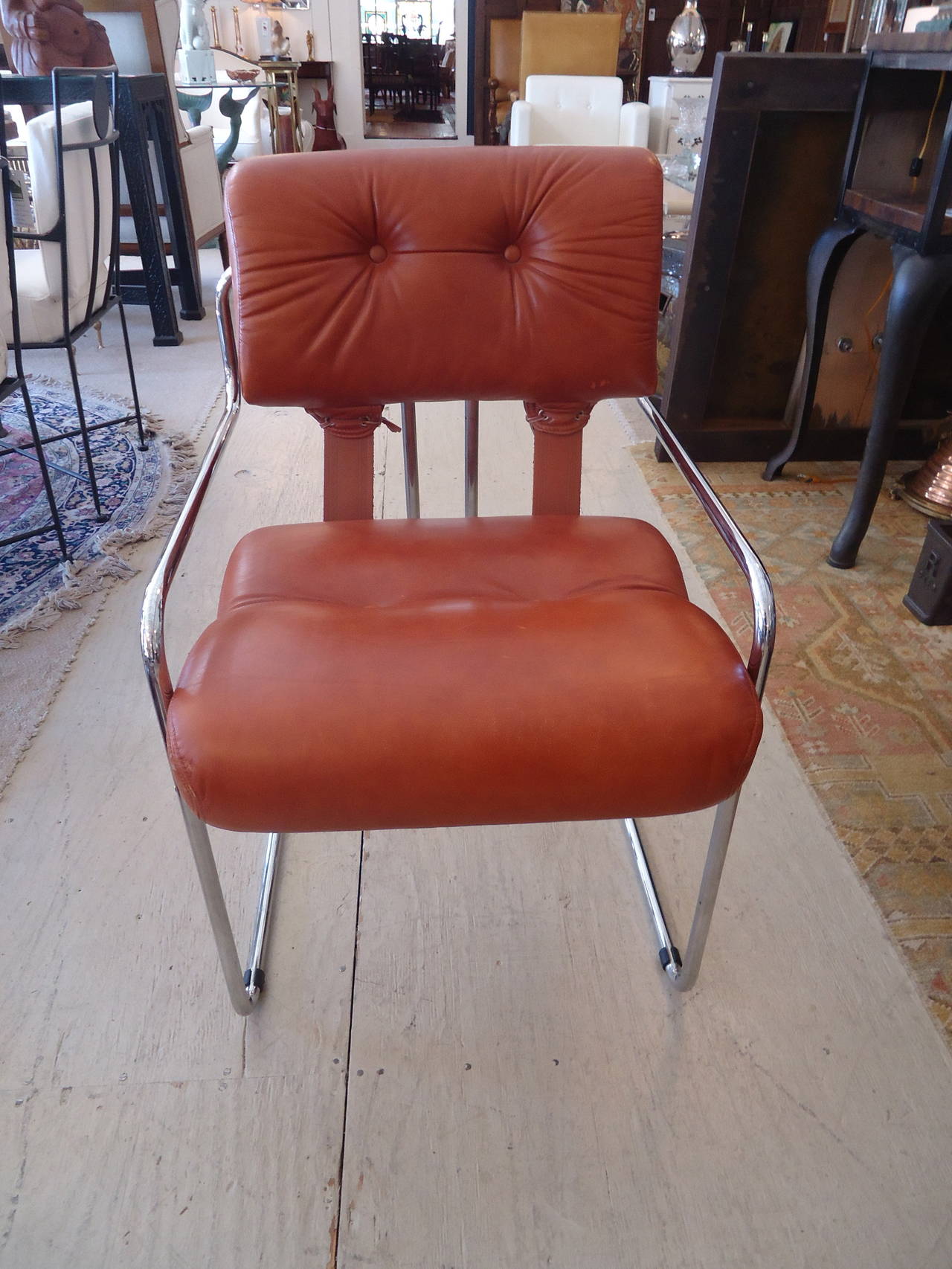 Set of six Italian Mid-Century Modern chrome and buttery cognac colored leather dining chairs designed by Guido Faleschini for the Pace Collection. Gorgeous design with strappy detailing, double tufts in upper back, elegant streamline chrome bases.