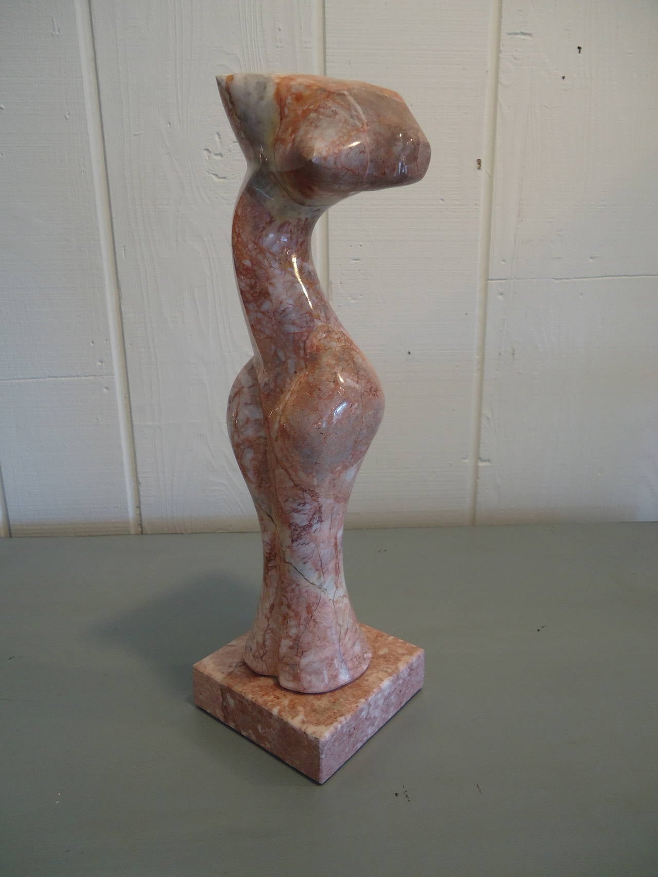 Gorgeous marble in pinks, maroon and cream, artfully sculpted to suggest the female form from every angle. Abstract and eye-catching. No signature.