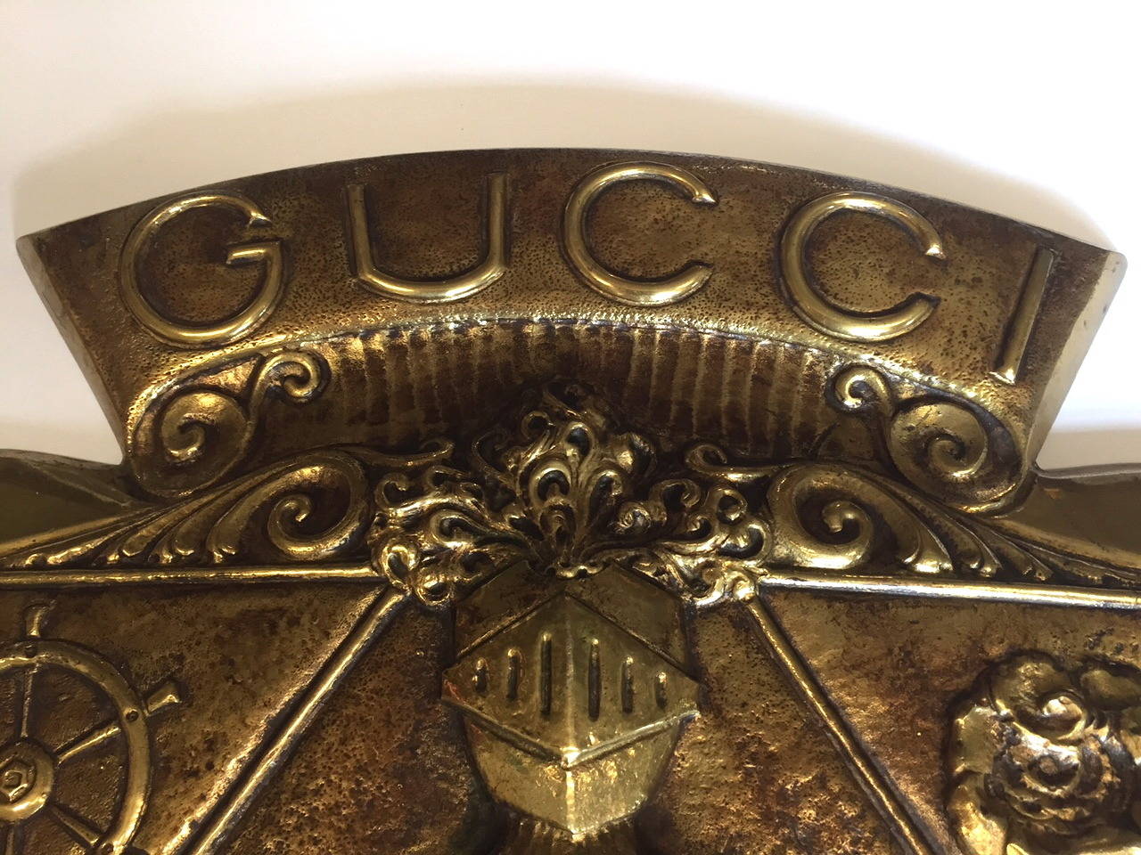 We think this chic bit of wall decor was a custom plaque that adorned a Gucci store at one time. Heavy solid and Gucci glamorous.
There are two threaded holes to allow for hanging.