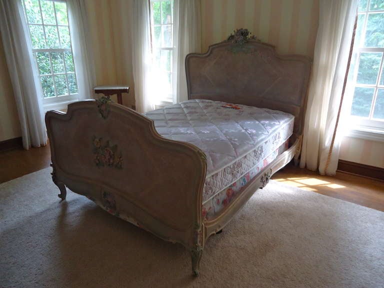 Louis XV style, antique French double bed, custom faux painted in lovely muted grey/rose surfaces.  Carved and painted floral head and foot boards and side rails.
Also has a matching armoire and small nightstand available.