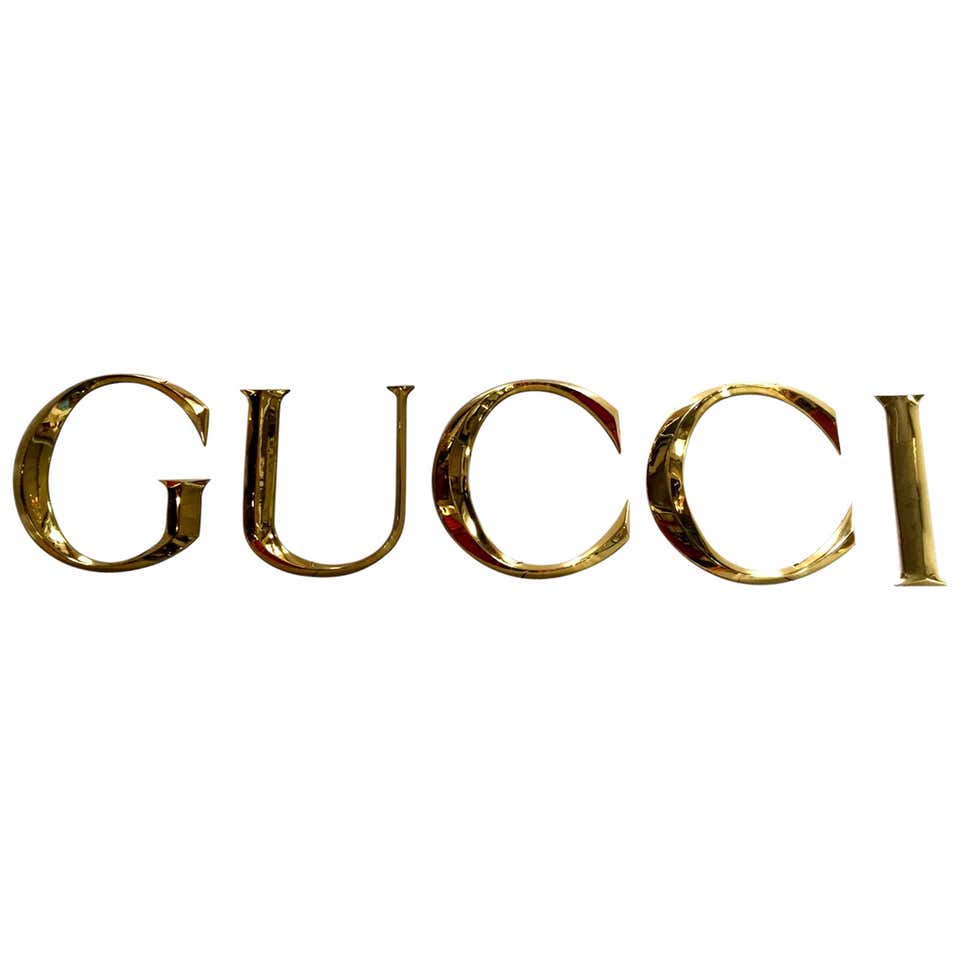Wonderful Brass Gucci Letters at 1stDibs