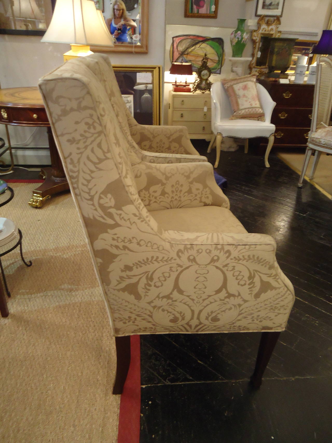 Vintage armchairs or fireside chairs, updated in a neutral beige/taupe Lee Jofa patterned fabric.  Mahogany legs.