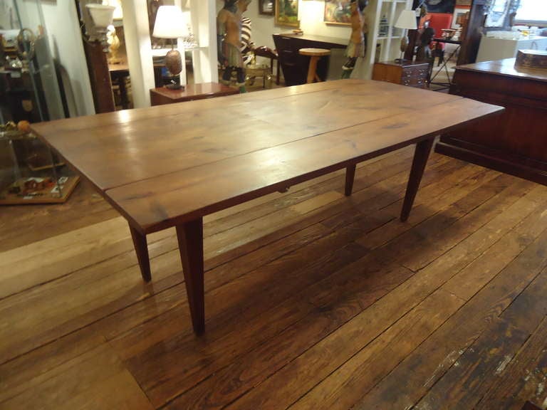 Wonderful old farmtable from Princeton farmhouse.  Pine and early 1900's.  Very versatile, as it's narrow when sides are down, measures 23.5 D, then wide with leaves extended. (43