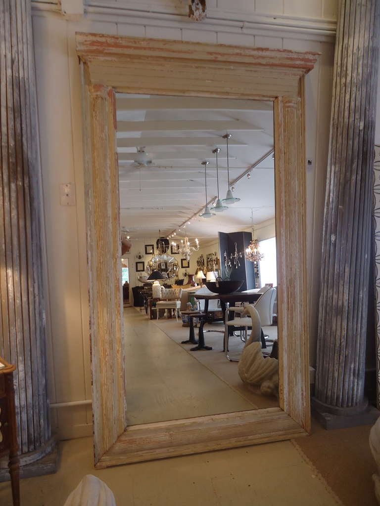 Seven and a half feet tall, this is an impressive vintage mirror, originates from the Scarsdale estate of the Marx Brothers.
Wonderful chippy distressed carved wood in creams and terracotta. Top has 5.5 Depth
