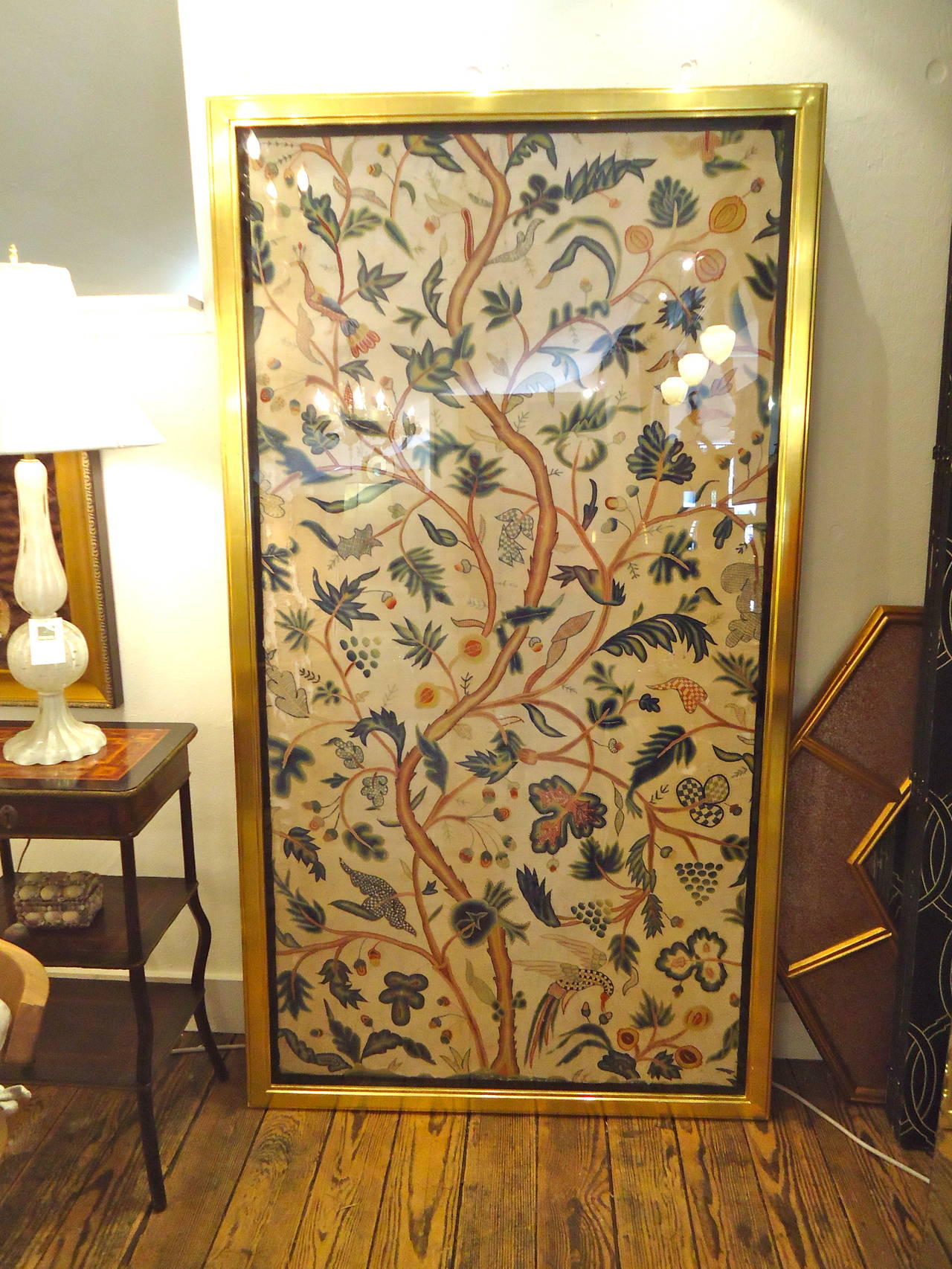 Two richly embroidered antique English bed panels probably based on an oriental representation of the tree of life with twisted branches, curling leaves, and exotic birds. The design was most likely also inspired in part by Verdure tapestries. While