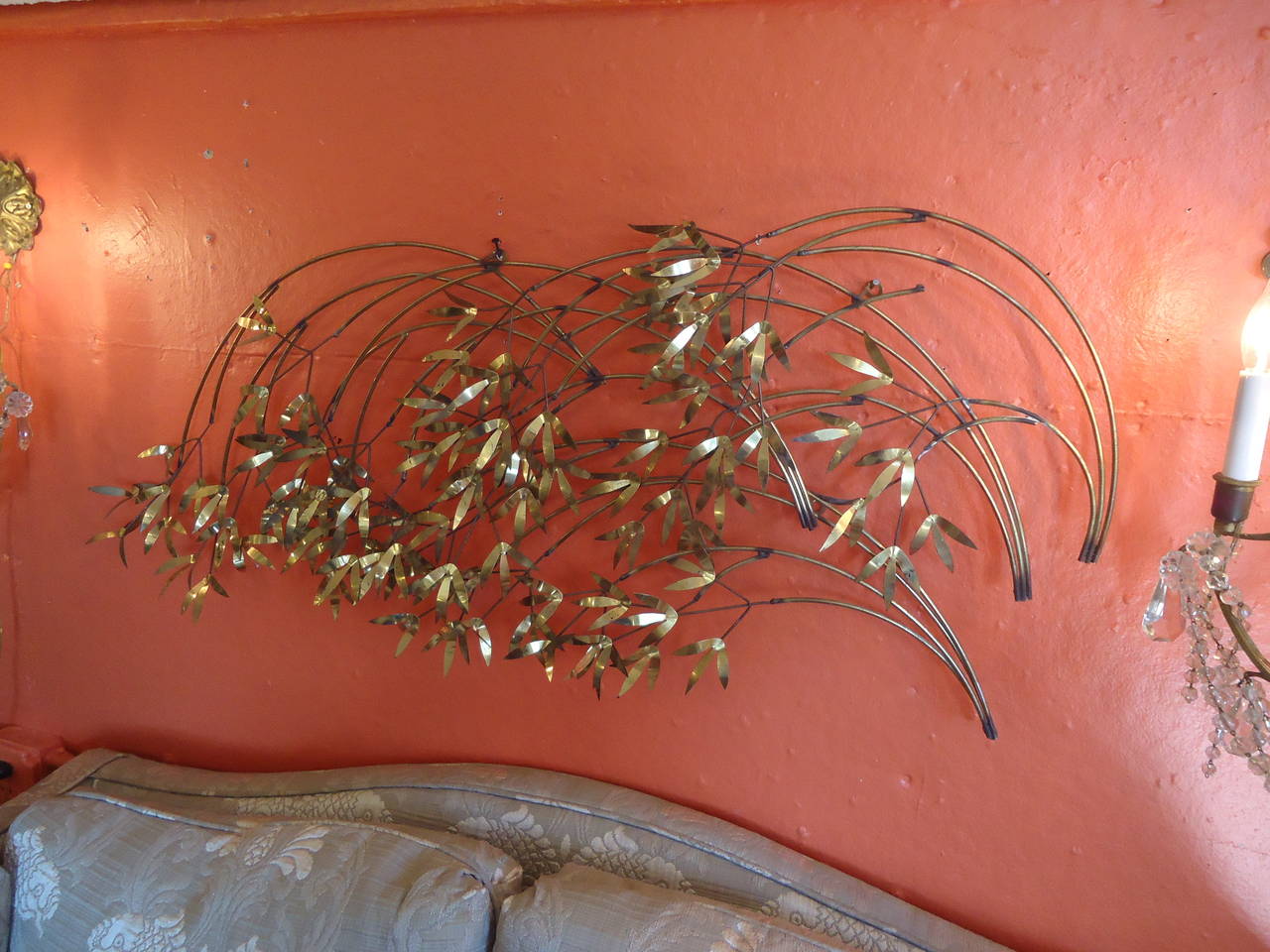 Metal and brass wall sculpture that looks like branches and leaves in an artistic arrangement. Signed on one leaf, Curtis Jere.